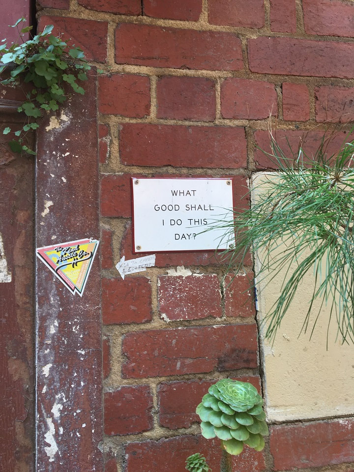  Inner city Melbourne alley with quote (what good shall I do today) on plaque